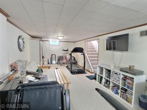 Ease downstairs into the family room complete with carpet, measures roughly 27x11 making it a great space to relax and enjoy a good show.