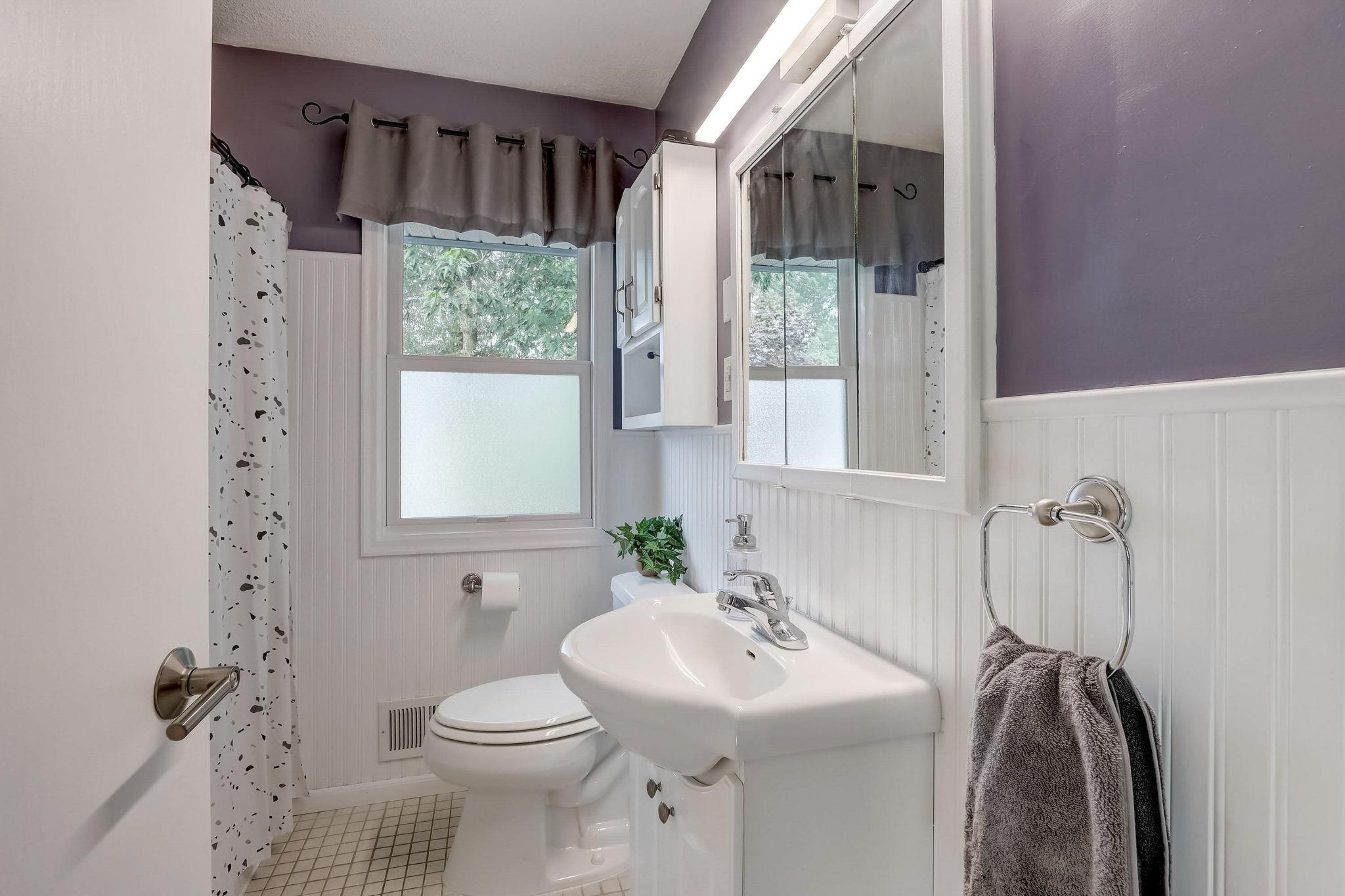 Nicely finished main level full bathroom.