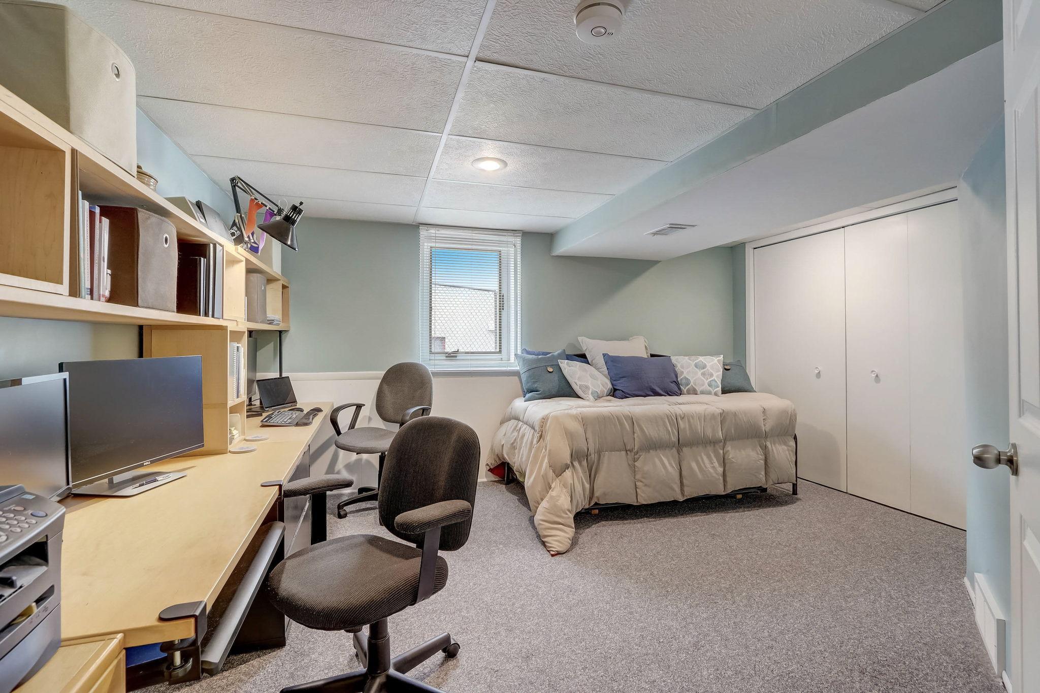 Spacious 4th bedroom situated on the lower level, a three-quarter bathroom, and a finished laundry room. Excellent storage within the utility room.
