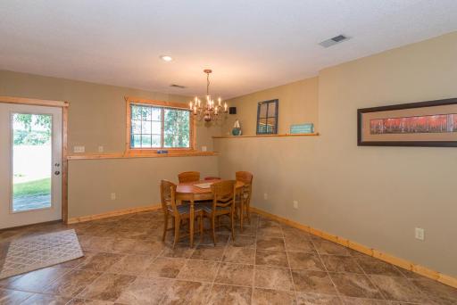 The lower level family room is a walkout to the lake. It makes for a great game or tv room. It has rich ceramic tile floor.