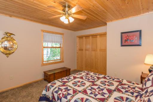 The 2nd of 3 bedrooms on the 2nd level. Most rooms have warm tongue and groove pine ceilings and panel doors.