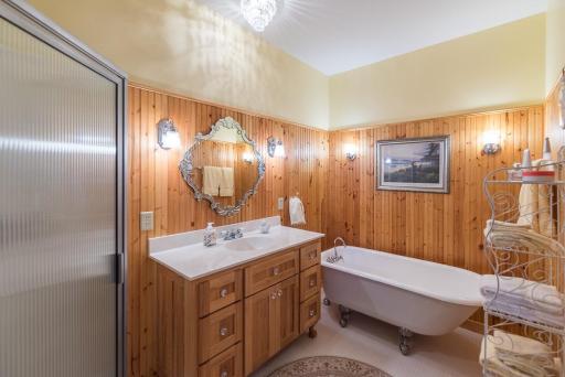 The owner's suite bathroom with a claw foot tub and shower.