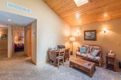 Another view of the loft. Vaulted wood ceilings with a skylight.