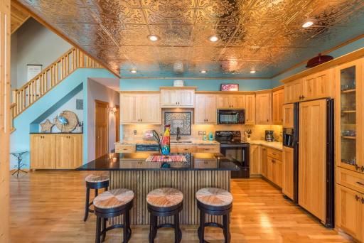 Beautiful hardwood floors through the sunroom, kitchen and greatroom.