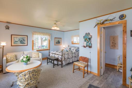 The guest cabin has a bedroom, living area, bathroom and breakfast bar.
