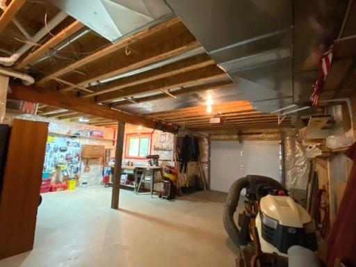 The unfinished portion of the lower level has an overhead door to store snowmobiles, lawn tractor etc. There is also a shop with a lakeside window. This area can be converted to extra living space, 876 Sq. Ft, finished to your own tastes.