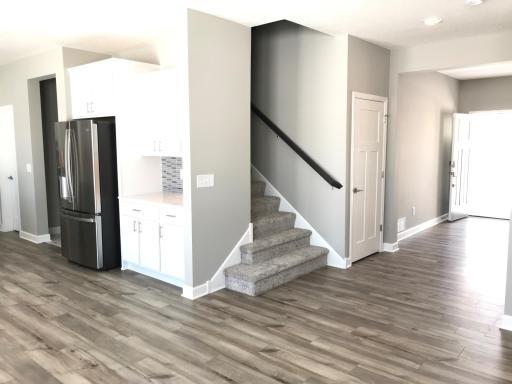 Elegant rainfall staircase to the upper level. Finishes will vary.jpg