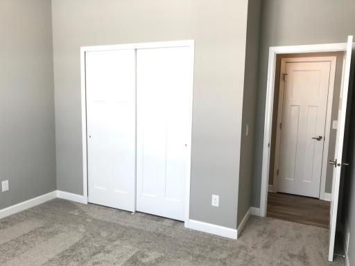 Spacious 13x12 main floor bedroom with bath around the corner. Finishes will vary.jpg