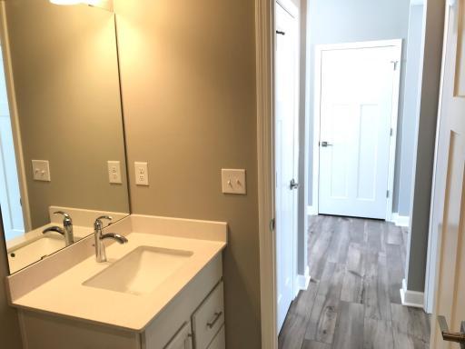 Main level guest bath with quartz counter tops and quality fixtures.jpg