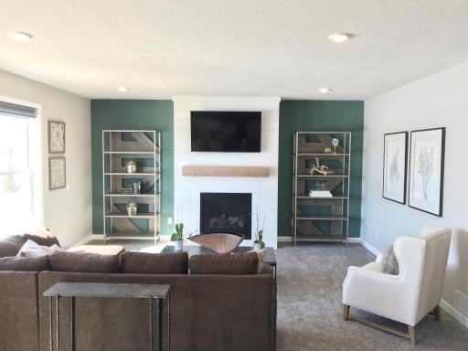 Main level family room is so comfortable and is enhanced by the open concept design..jpg