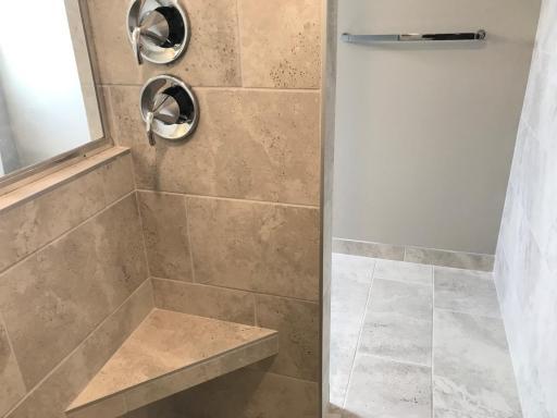 1 The owners bath with walk-in shower has dual shower heads and beautiful tile you will love! Finishes will vary