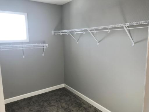 Primary bedroom closet built for two with window for natural light! Finishes will vary.