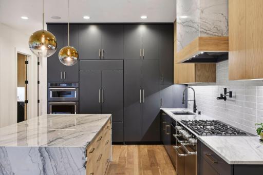 The 10ft custom cabinets, and upscale appliance suite, with Aga and Subzero appliances, are complimented by a separate prep kitchen.