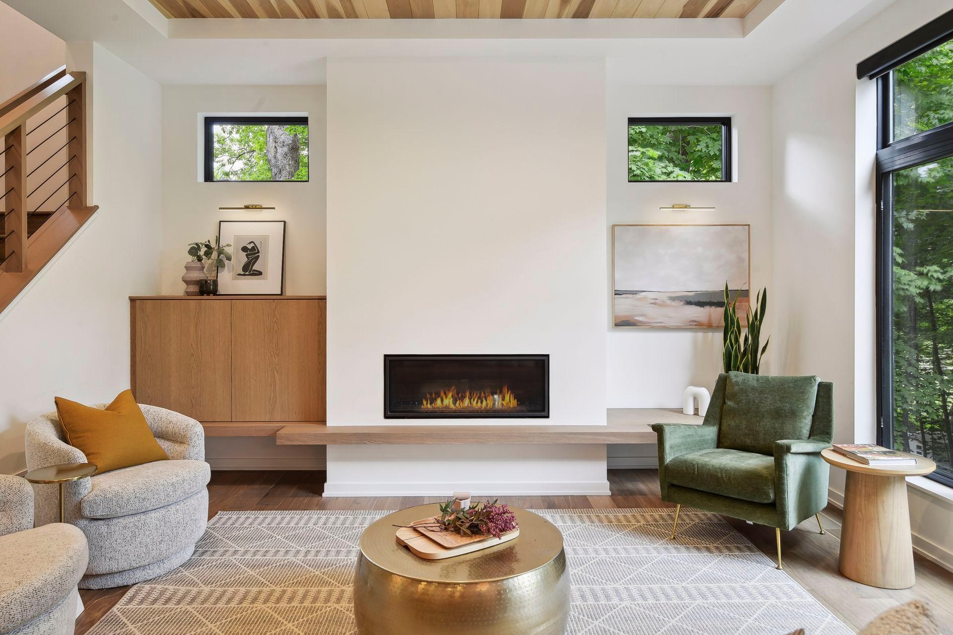 Custom oak cabinetry wraps the great room fireplace and sets the scene for an elevated living experience.
