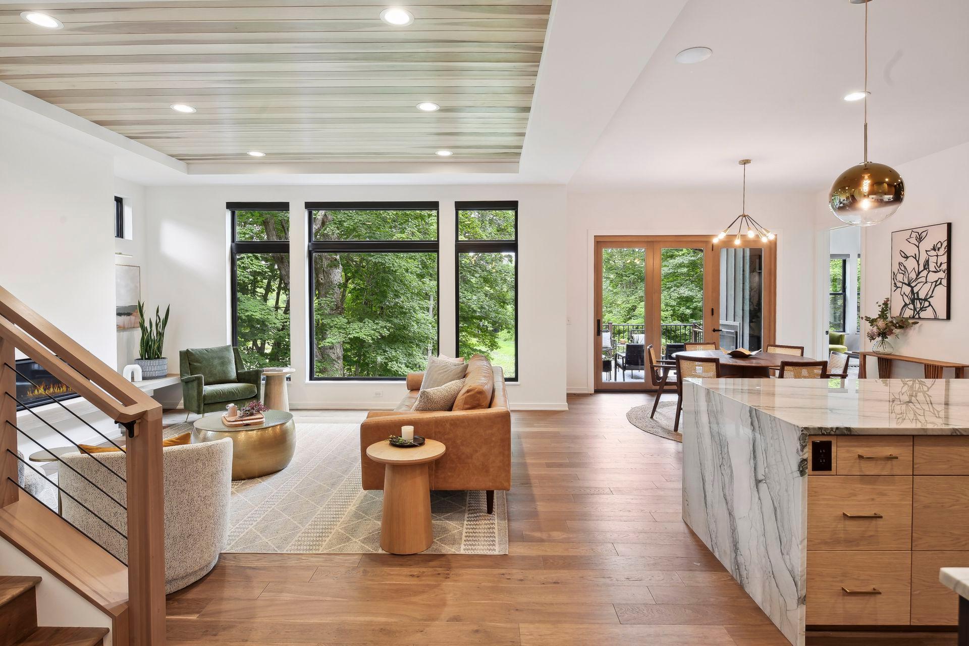 Hardwood floors on main and upper levels are complemented by large picture windows that invite the outside in