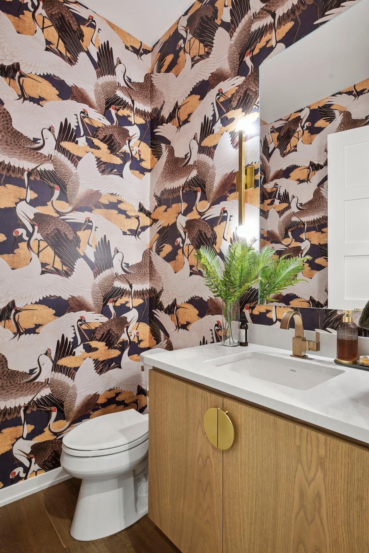 photo-0048.jpgThe powder room features vibrant maximalist crane wallpaper, a fun departure from the calming interior of the rest of the home.