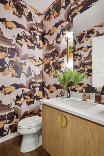 photo-0048.jpgThe powder room features vibrant maximalist crane wallpaper, a fun departure from the calming interior of the rest of the home.