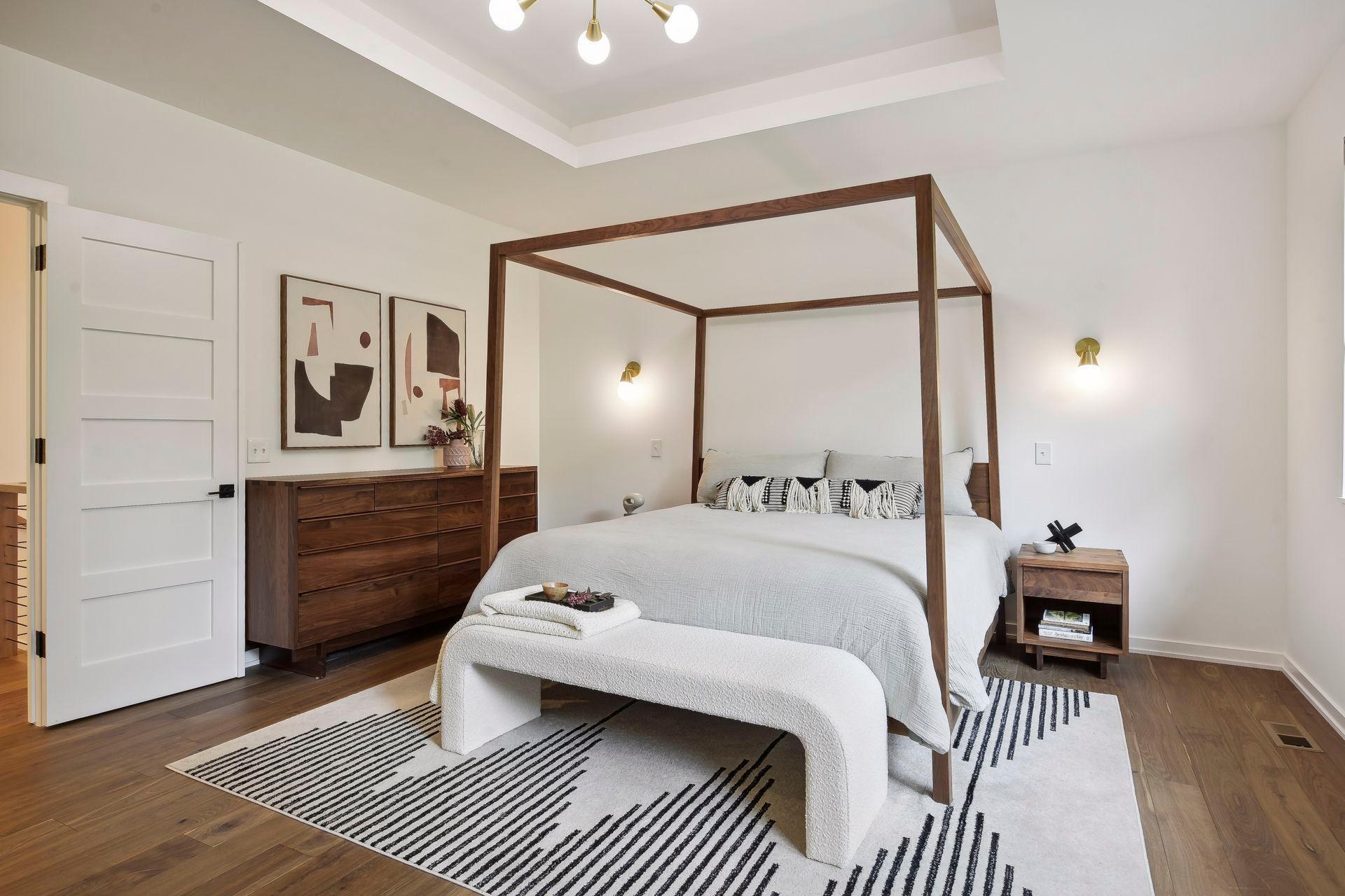 The generous primary suite features two walk in closets with upscale finishes. Oversized windows allow for beautiful views of the private backyard and Lake William.