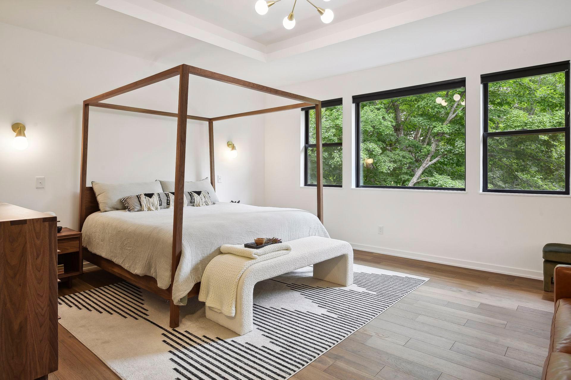 The generous primary suite features two walk in closets with upscale finishes. Oversized windows allow for beautiful views of the private backyard and Lake William.