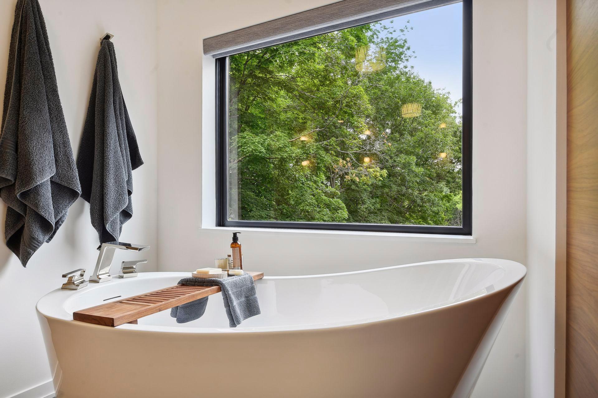 The soaking tub features it’s own window from which to enjoy the majestic fall colors or snow covered lake.