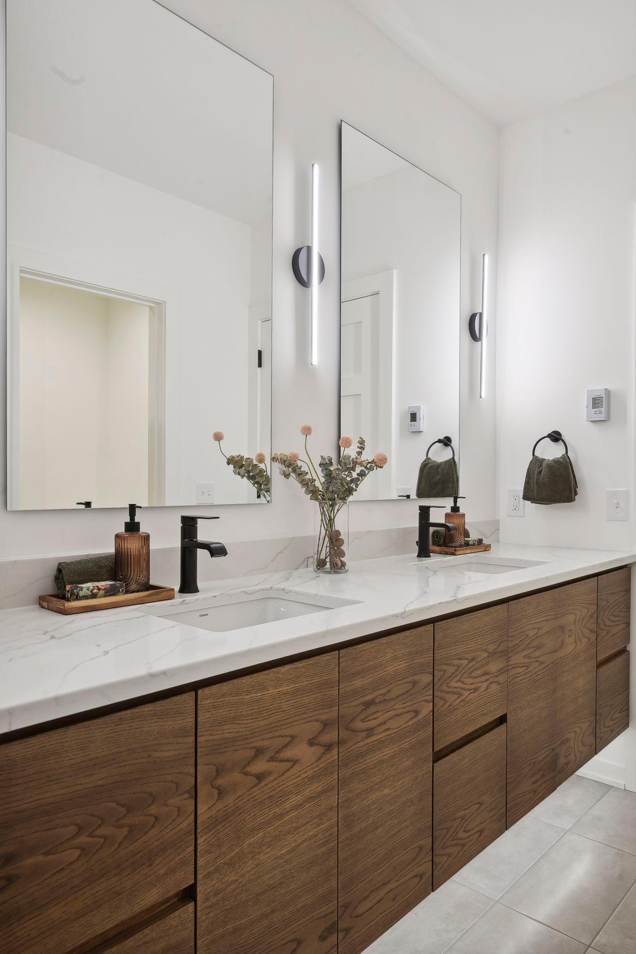 All full and 3/4 baths enjoy heated floors, quartzite countertops and generous vanity space.