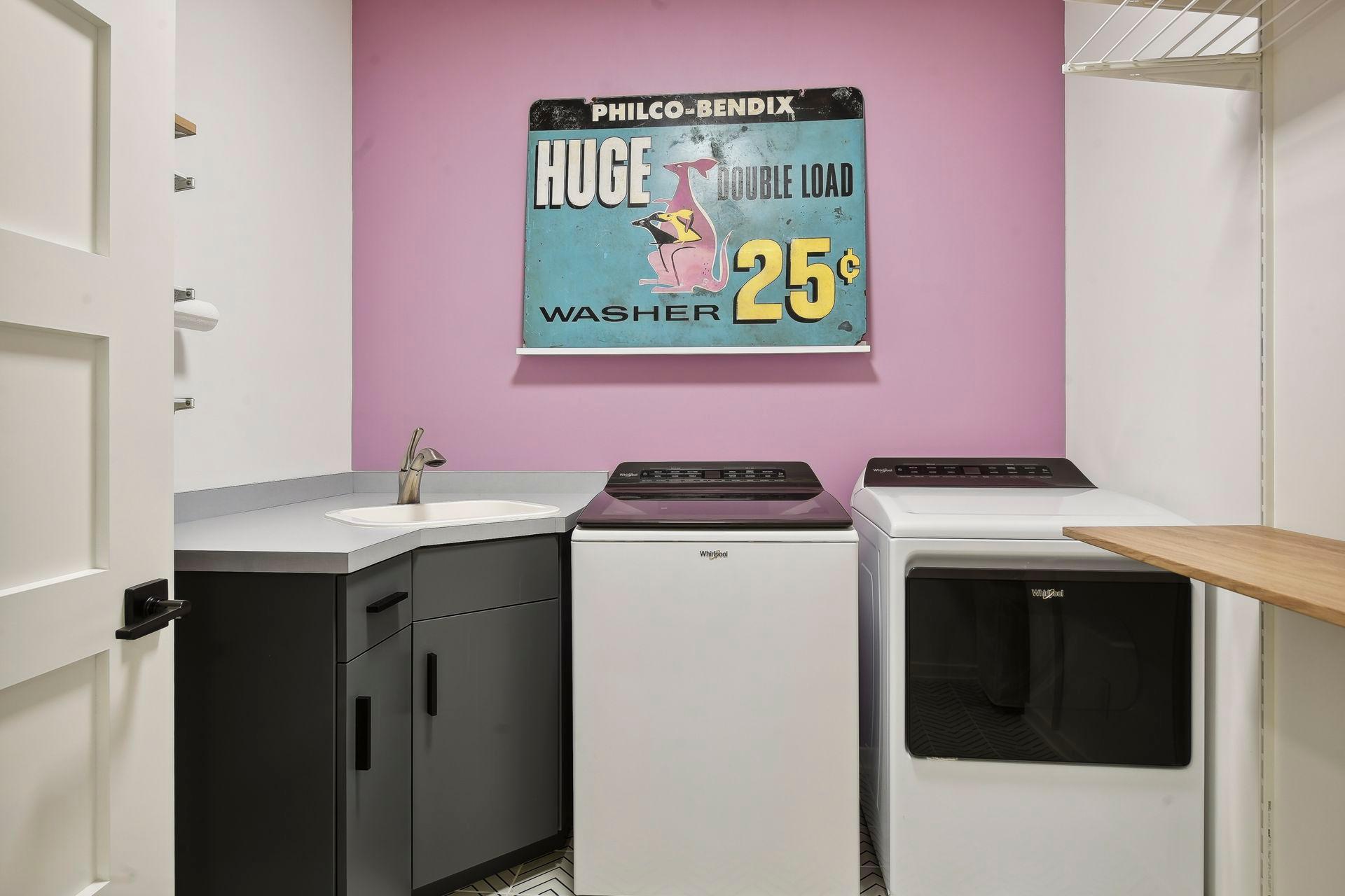 The upper level laundry features ‘wheel through’ baskets to the primary closets.