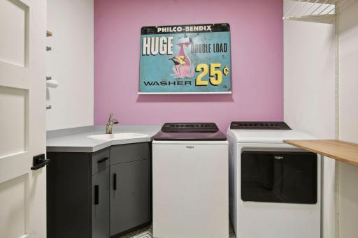 The upper level laundry features âwheel throughâ baskets to the primary closets.