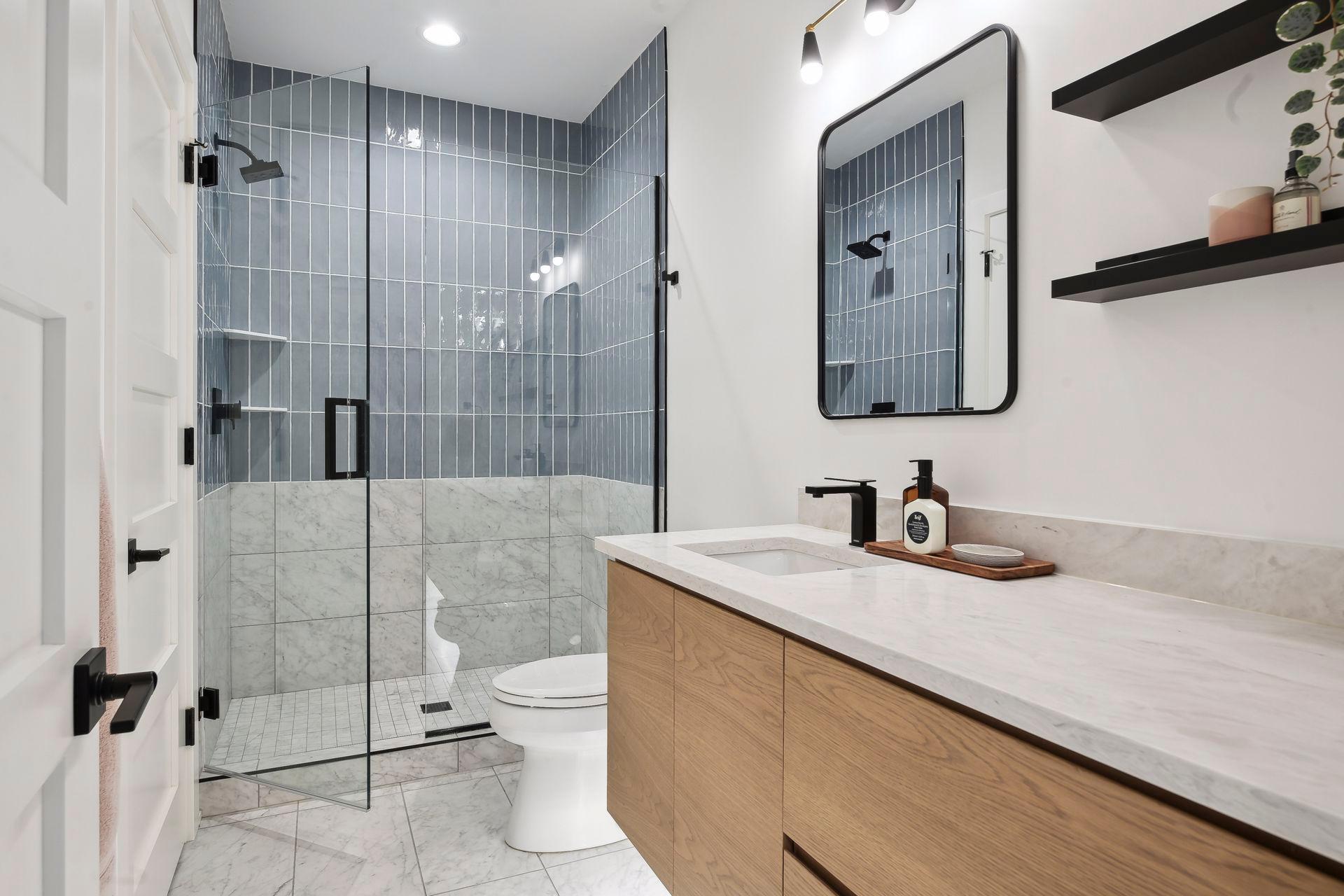 All full and 3/4 baths enjoy heated floors, quartzite countertops and generous vanity space.