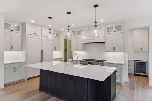 Large refrigerator and freezer in the center island kitchen