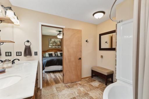 View from primary ensuite bath to the bedroom.