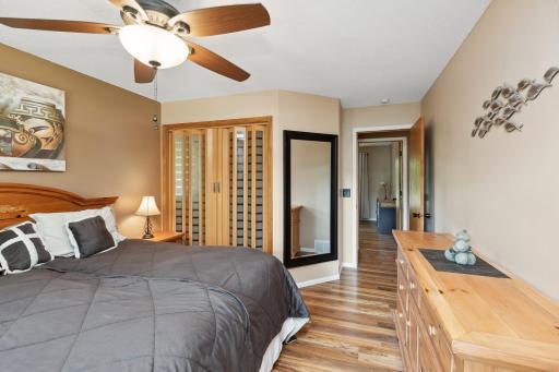 The primary bedroom with walk in closet and private ensuite bath enjoys water views.