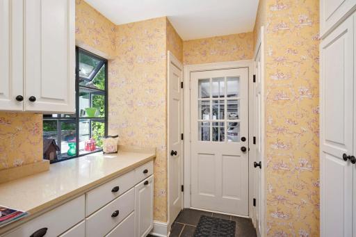 Mudroom with closet and cubbies to the 3 car garage