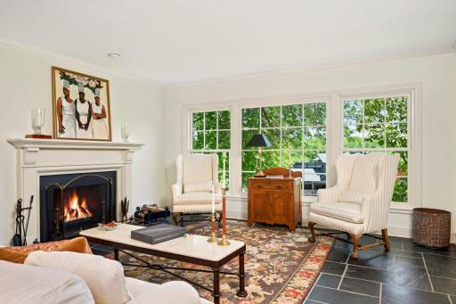 A wood burning fireplace with Federal mantel