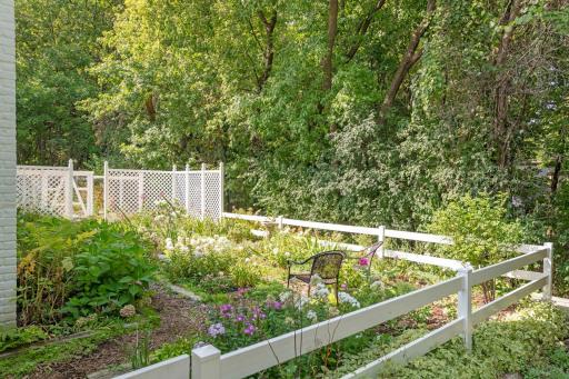 Perienail gardens and old dog rum on the north side of the home