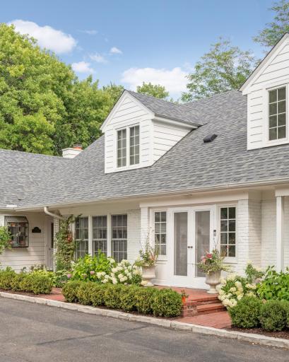 The home originally had shutters on the dormer windows