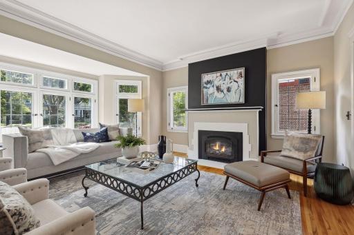 Photo for 2708 Irving Avenue S, Minneapolis, MN 55408 - Listing #6391325 Gas fireplace as the centerpiece between additional, south-facing windows