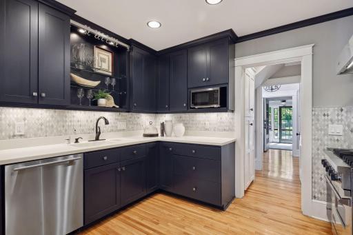 Photo for 2708 Irving Avenue S, Minneapolis, MN 55408 - Listing #6391325 Brightly lit kitchen with ample lighting and freshly painted cabinets