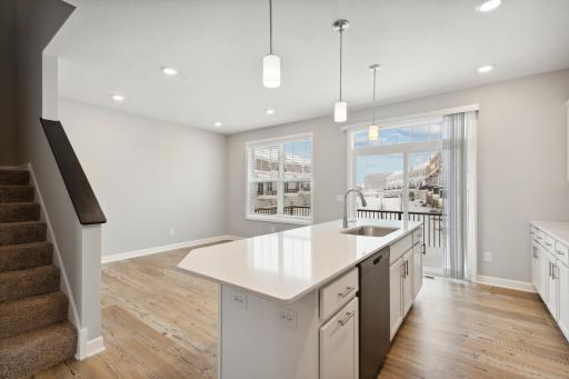 Open dining space which can also be a family room. Photos are not of actual home. Actual home will be similar. Some colors and features may vary.