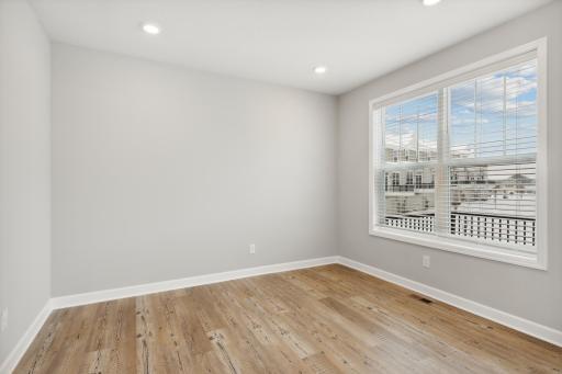 Plenty of windows overlooking a private deck. Photos are not of actual home. Actual home will be similar. Some colors and features may vary.