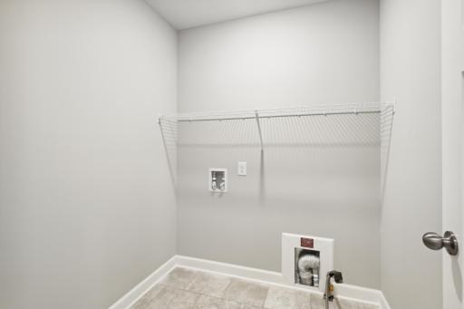 Laundry room and the 2nd level conveniently located next to the bedrooms. Photos are not of actual home. Actual home will be similar. Some colors and features may vary.
