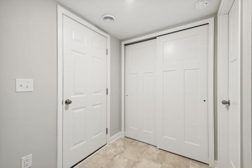 Lower level mudroom entry from the garage. Photos are not of actual home. Actual home will be similar. Some colors and features may vary.