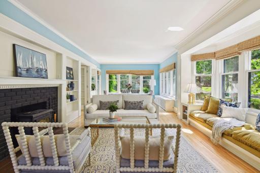 Grand but open living room/ dining area and built in bay window seating.