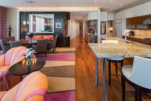 Long, expansive view of the main living area and custom curved walls lending character throughout.