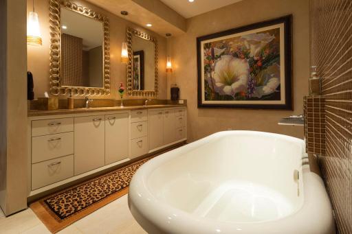 Master suite bathroom with double sinks and opulent accents. Jetted tub with walk in shower and in-floor heating for the cold winter months!