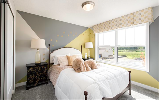 Bristol Bedroom two of four on the upper level offers large windows. Previous home, finishes will vary.