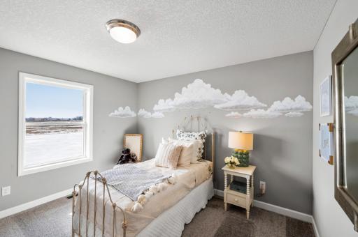 Each of the home's secondary bedrooms on the upper level come perfectly sized and all feature their own private walk-in closet. Model Floorplan. Actual home finishes will vary.