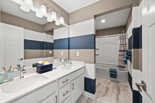 Ample room in the upper level shared bathroom. Model Floorplan. Actual home finishes will vary.