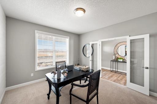 Located just off the foyer, this main level flex room provides endless opportunities; including a home office, formal dining area, an extra playroom or another sitting room. Model Floorplan. Actual home finishes will vary.