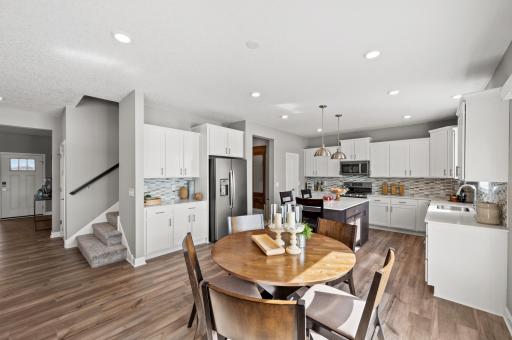 The main level living area is enhanced by the modern 9’ high knockdown ceilings and the open concept floorplan that flows from room to room. Model Floorplan. Actual home finishes will vary.