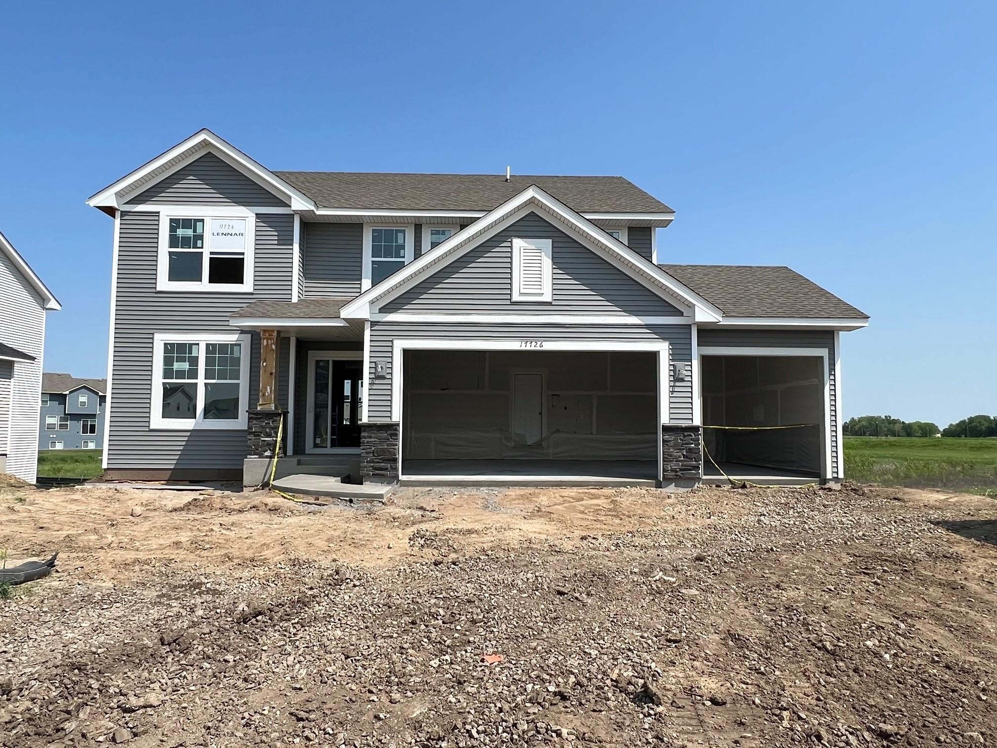 A stunning display from the street, introducing Lennar's popular Lewis plan. This home comes complete with irrigation, landscaping, trees and a full yard of sod!